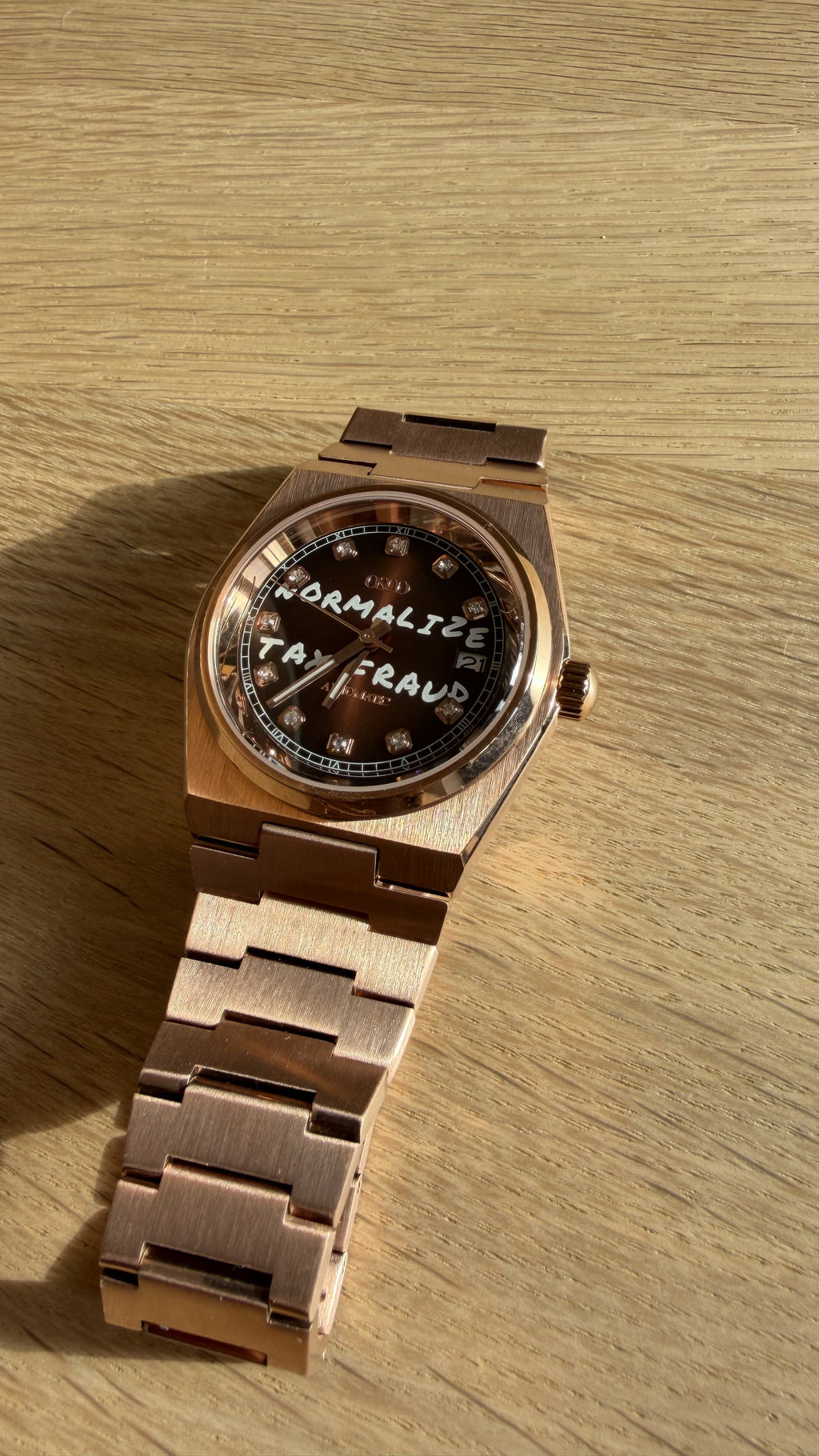 NORMALIZE TAX FRAUD Rose Gold automatic watch