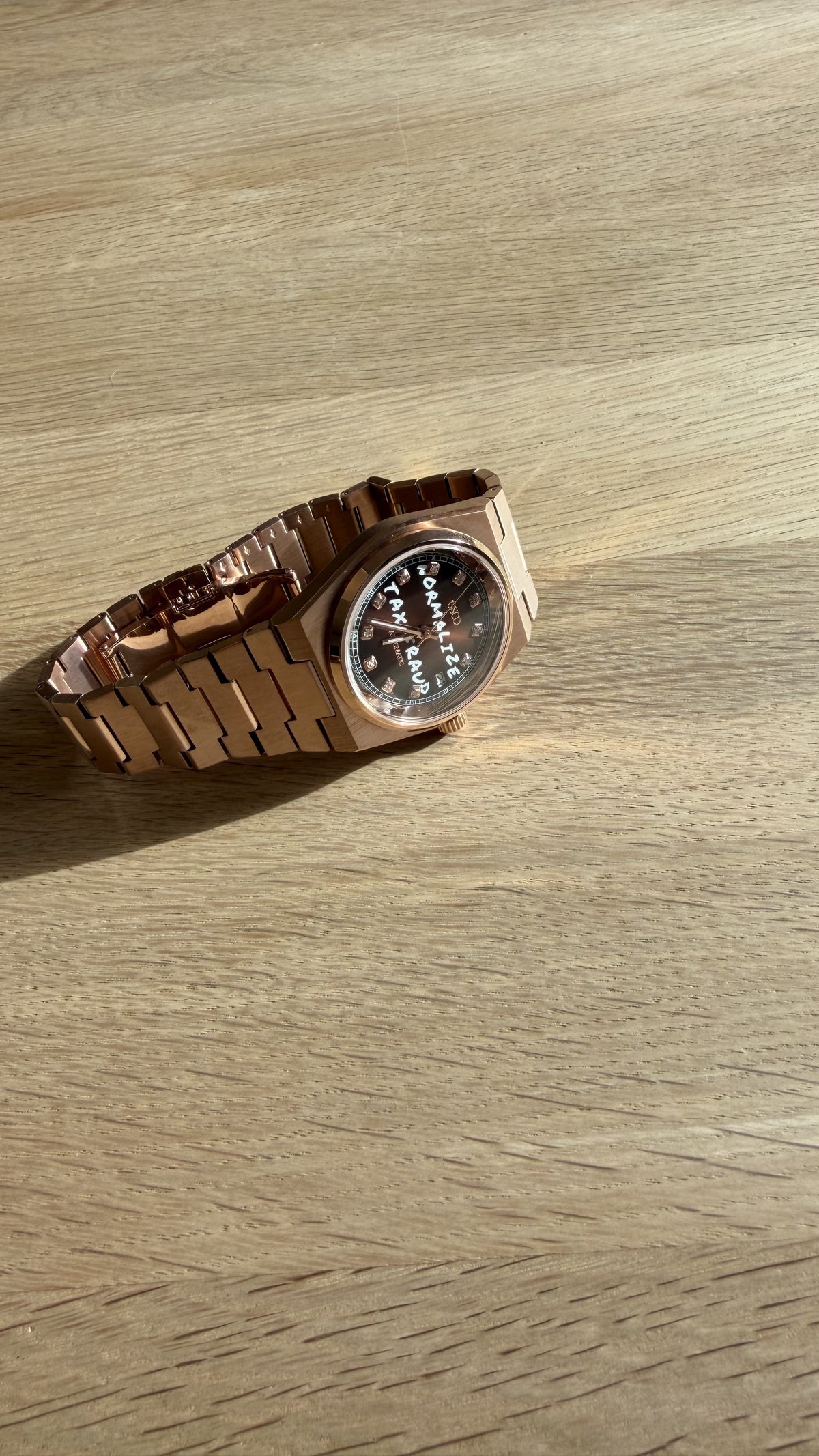 NORMALIZE TAX FRAUD Rose Gold automatic watch